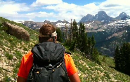 Gt Jedediah Smith 17934 Guide Jeff Jung leads the hike into the Jedediah Smith Wilderness. The Cathedral section of the Tetons lies beyond.