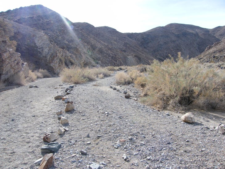 Rocks mark the trail. None