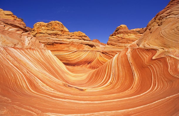 The Wave, Paria Canyon-Vermillion Cliffs Wilderness, AZ The Wave offers a breathtaking cross-section of geologic history. Its rippling sandstone formations have been eroded by wind and water, and reveal…