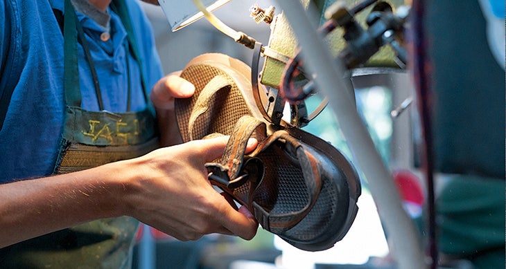 Made in America: Chaco Made in America: A Chaco employee in Rockford, Michigan, trims the outsole on a custom sandal.