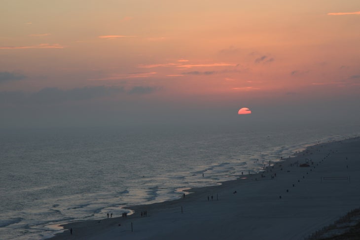 Sunset over Orange Beach, AL Watch the sun melt below the horizon on Orange Beach, AL