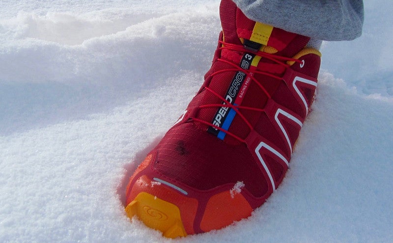 "trail runner in snow"