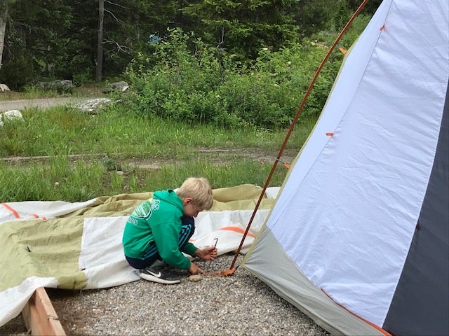 Unknown setting up tent