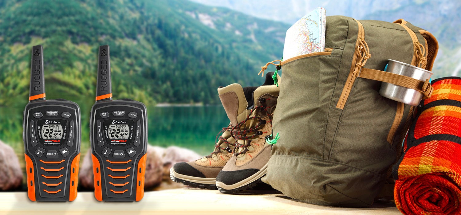 "Cobra walkie talkies sit to the right of the frame with mountains and an alpine lake in the background. To the right of the image sit a backpack,&hellip;"