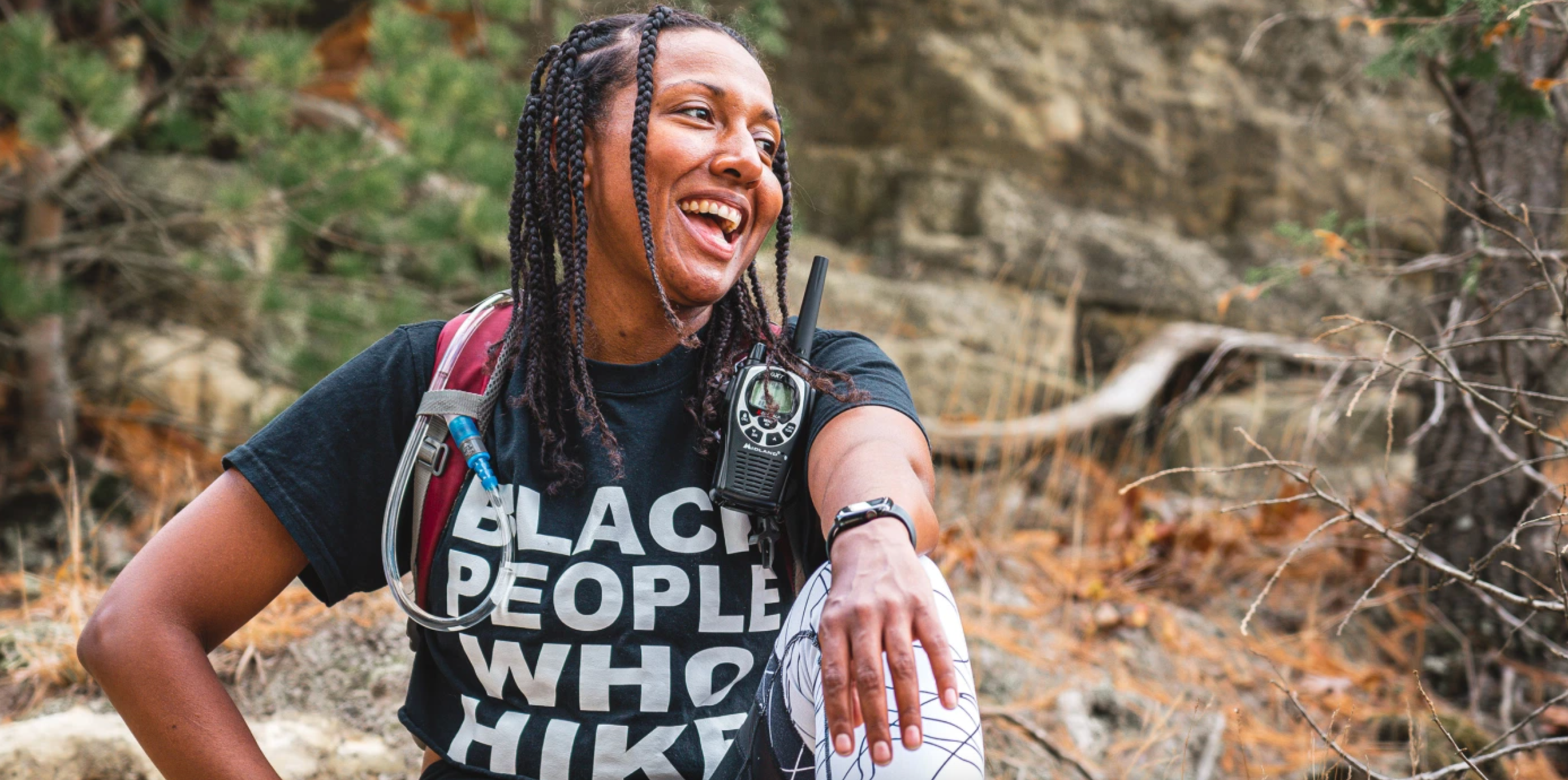 hiker sitting on rock