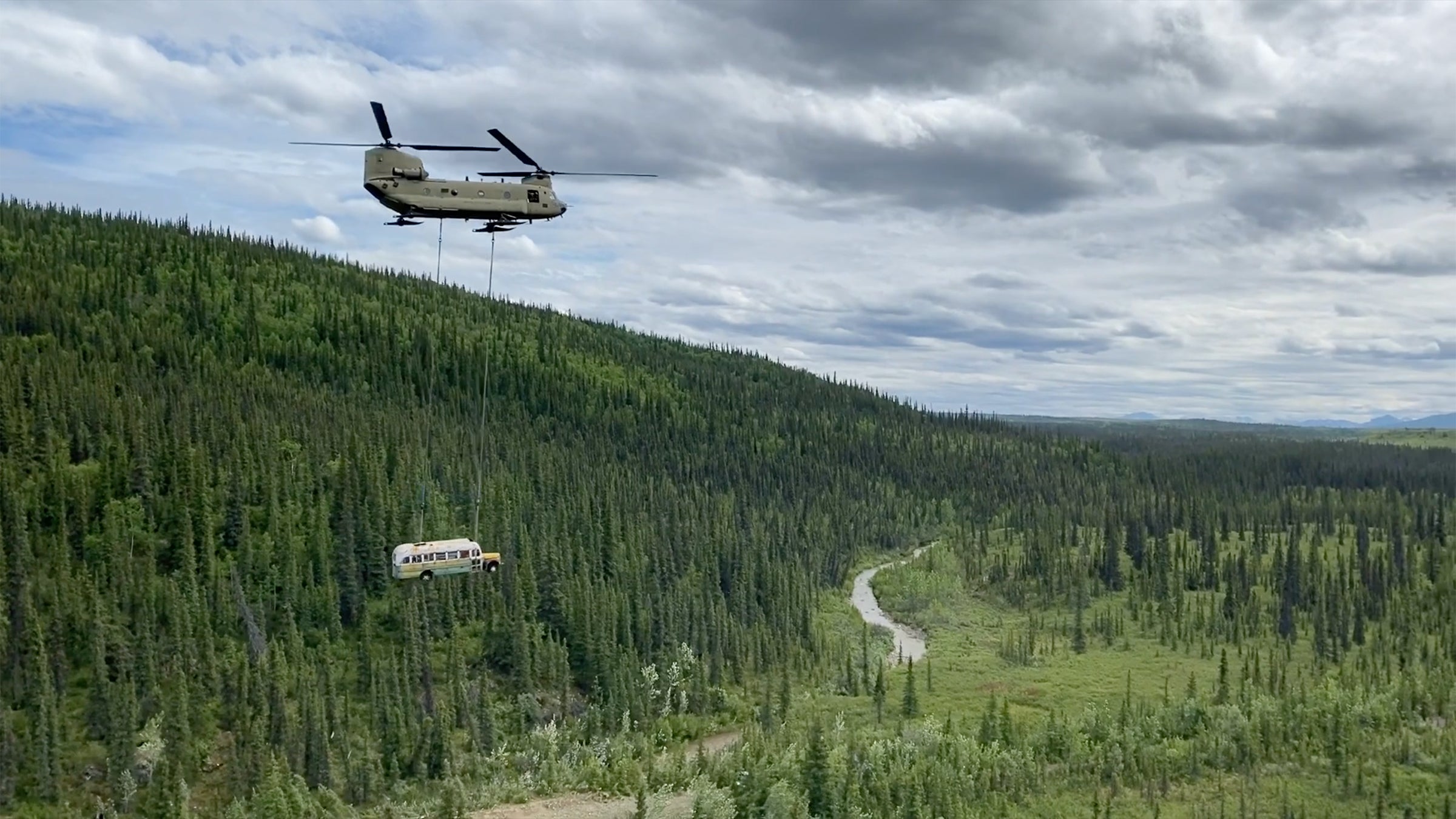 Bus being airlifted by helicopter