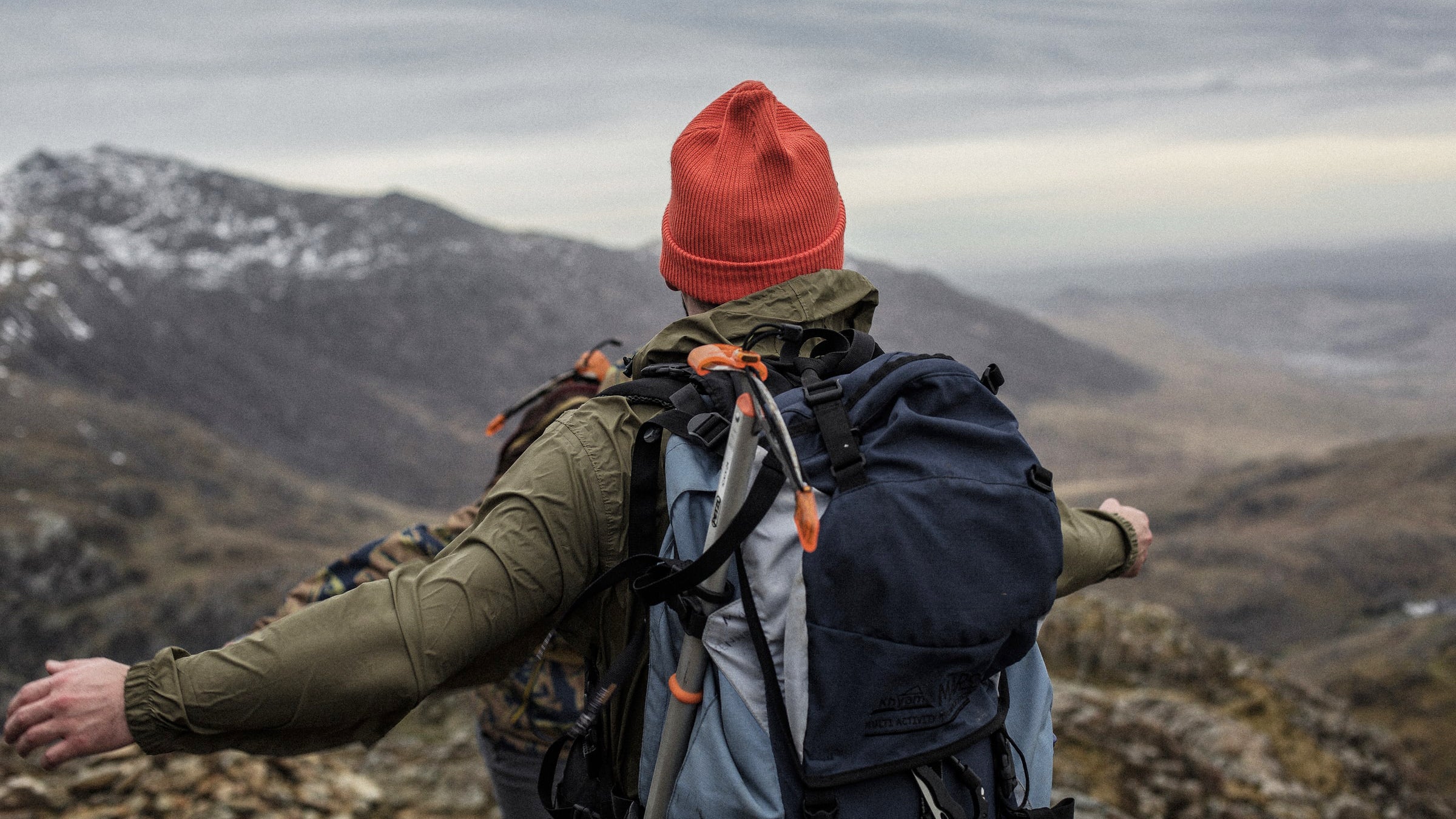 climber with an ice ax on their pack