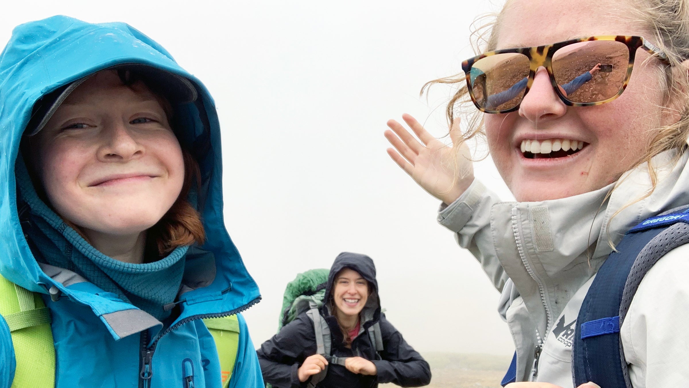 3 hikers wearing shells