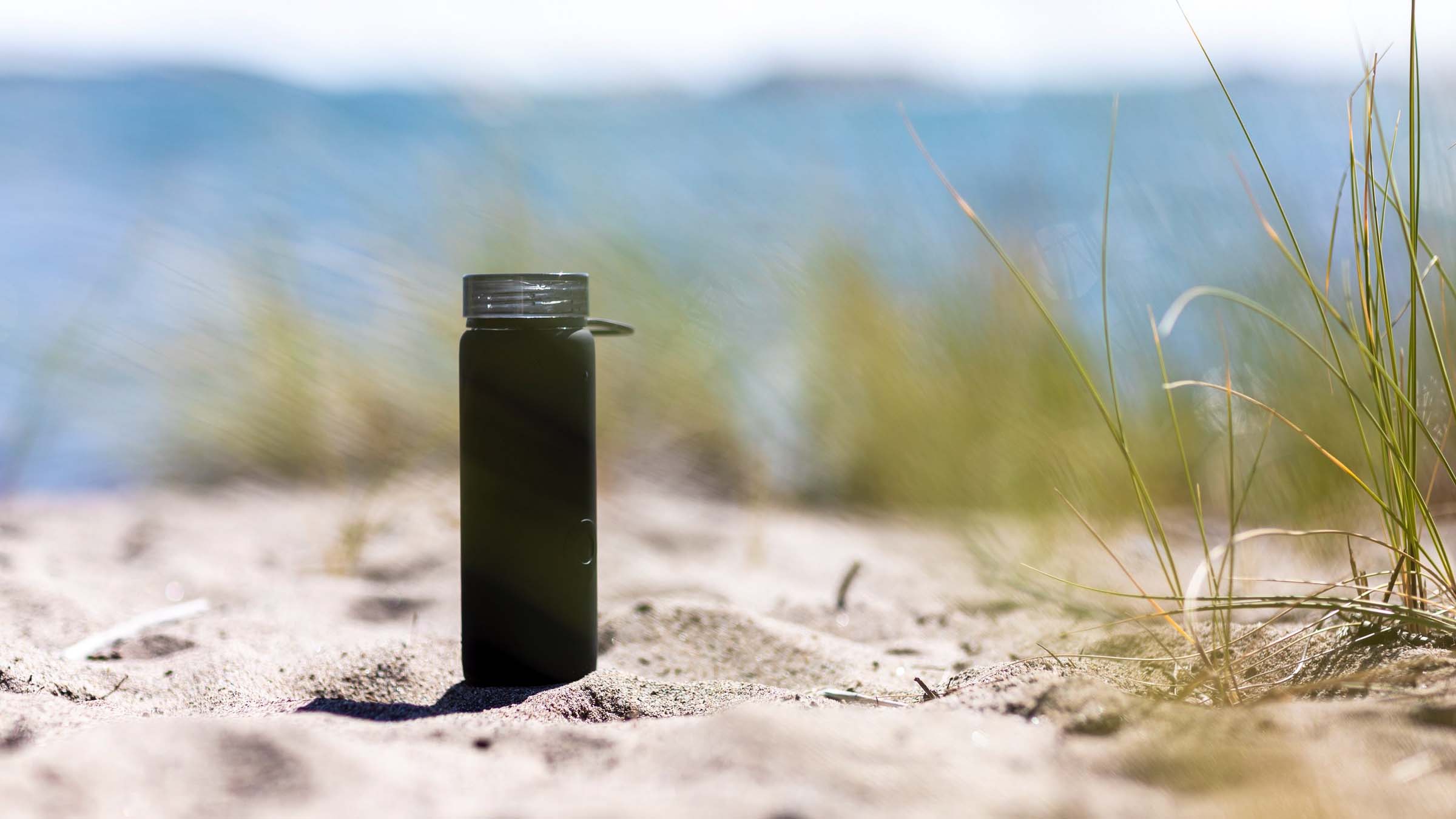 Water bottle on beach