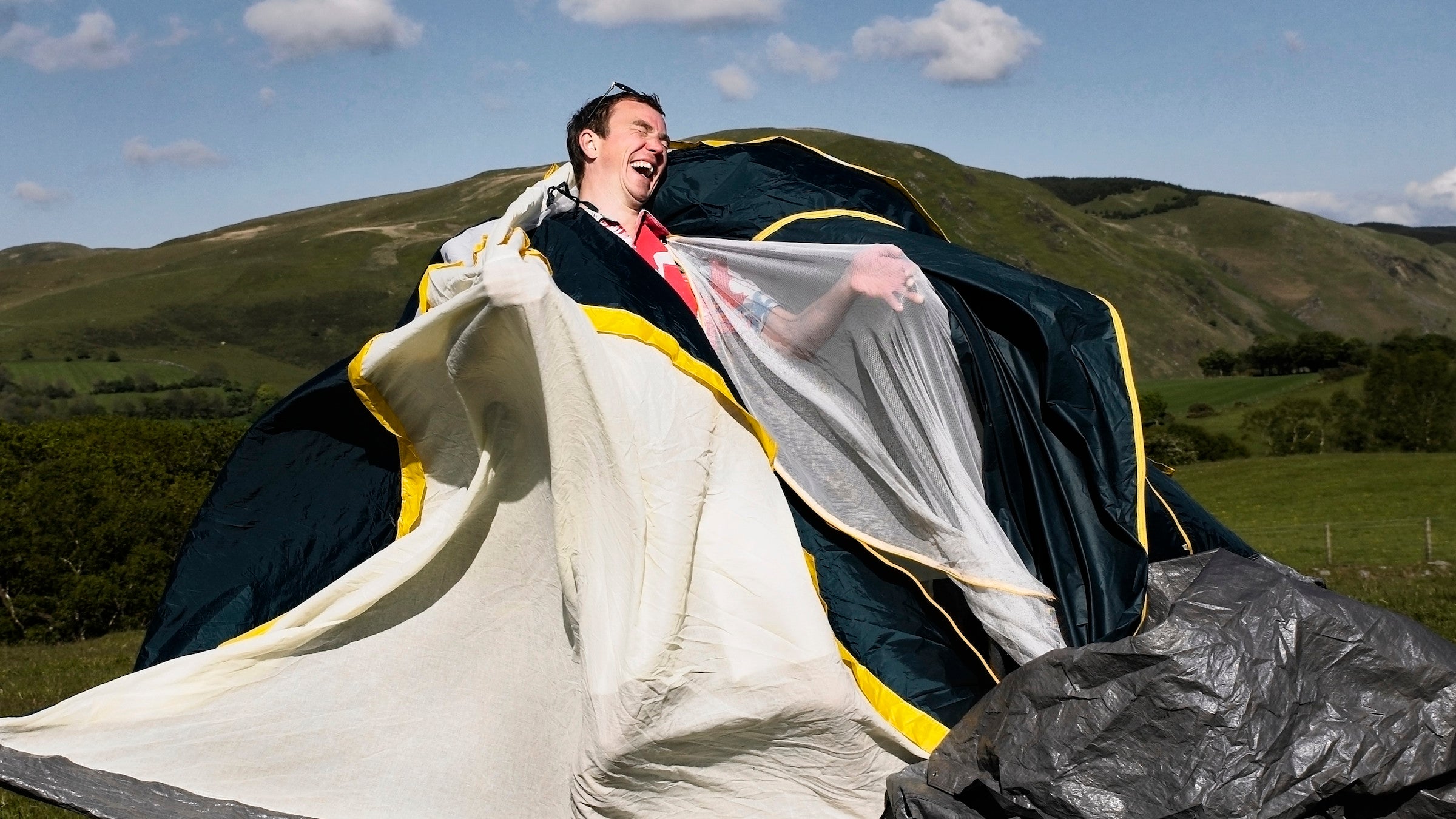 feature image showing man tangled in tent