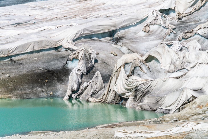 White blankets protecting Rhone Glacier from extreme melting due to global warming, Gletsch, canton of Valais, Switzerland