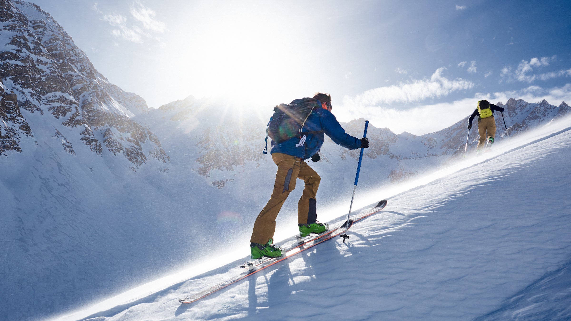 ski touring up a snowy slope