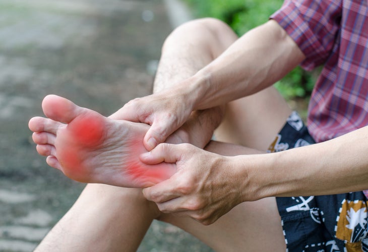 Man massaging sore feet