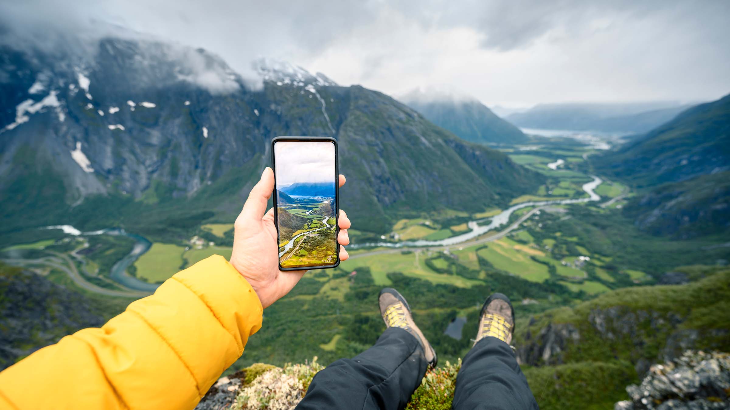 Hiker Taking Picture With Phone