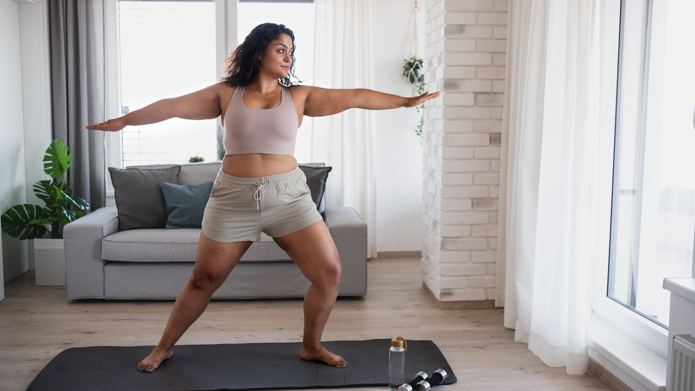 woman doing yoga at home