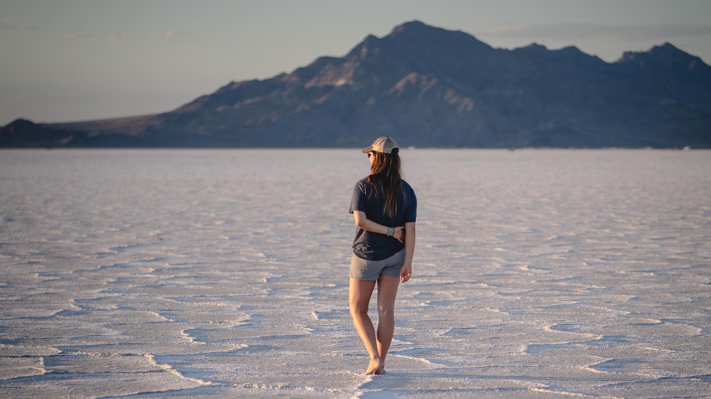 dani mortell stands facing away from the camera looking into the distance while recovering from long covid