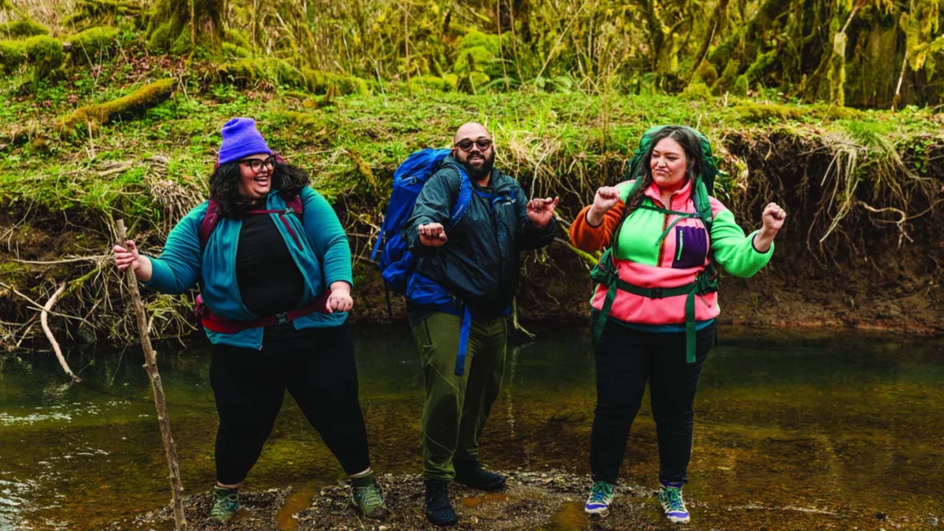 Three Hikers Dancing on Trail