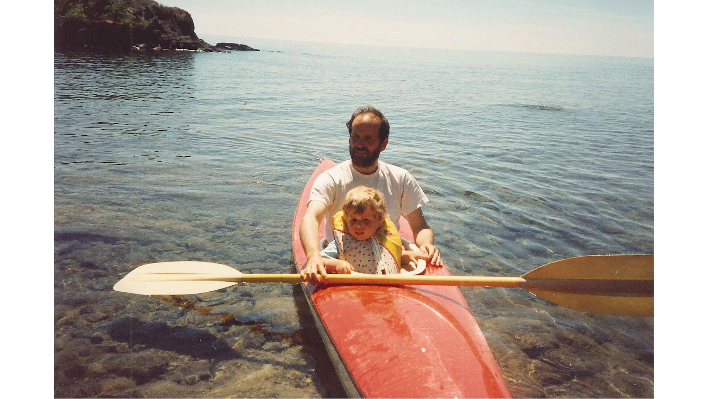 The author, as a child, and his dad on a kayaking trip