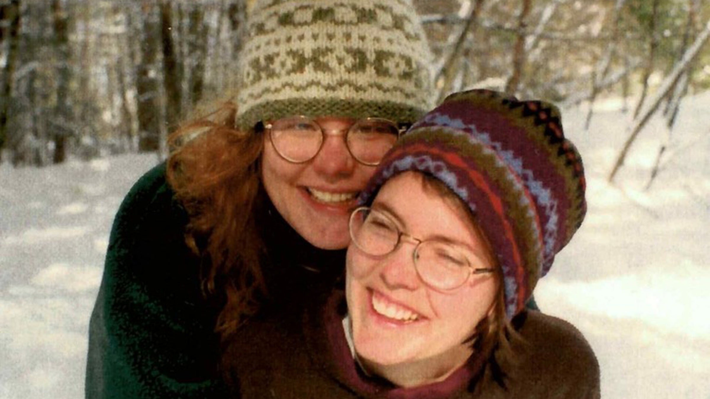 Two women embracing outside