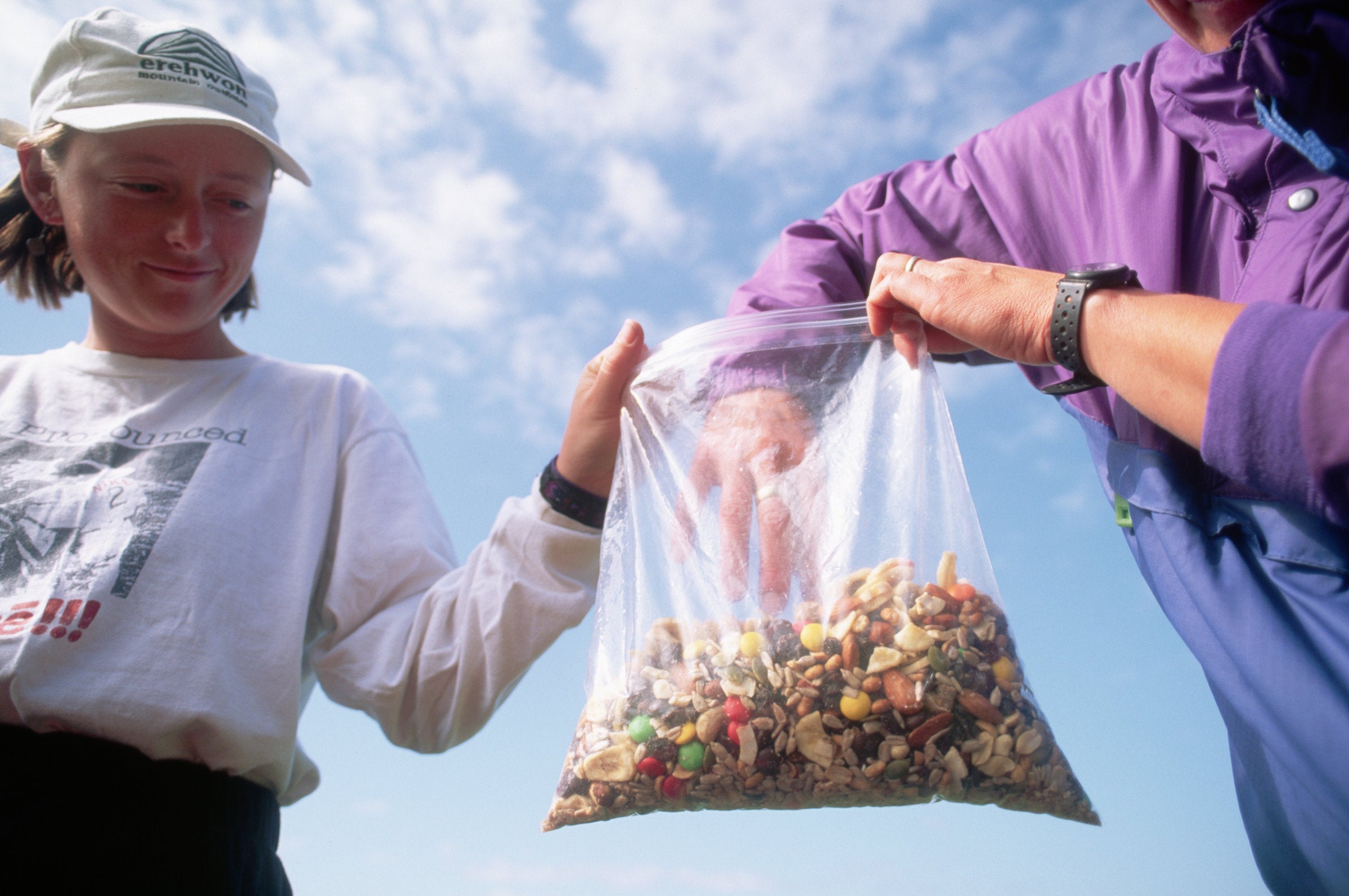 Two hikers eating gorp