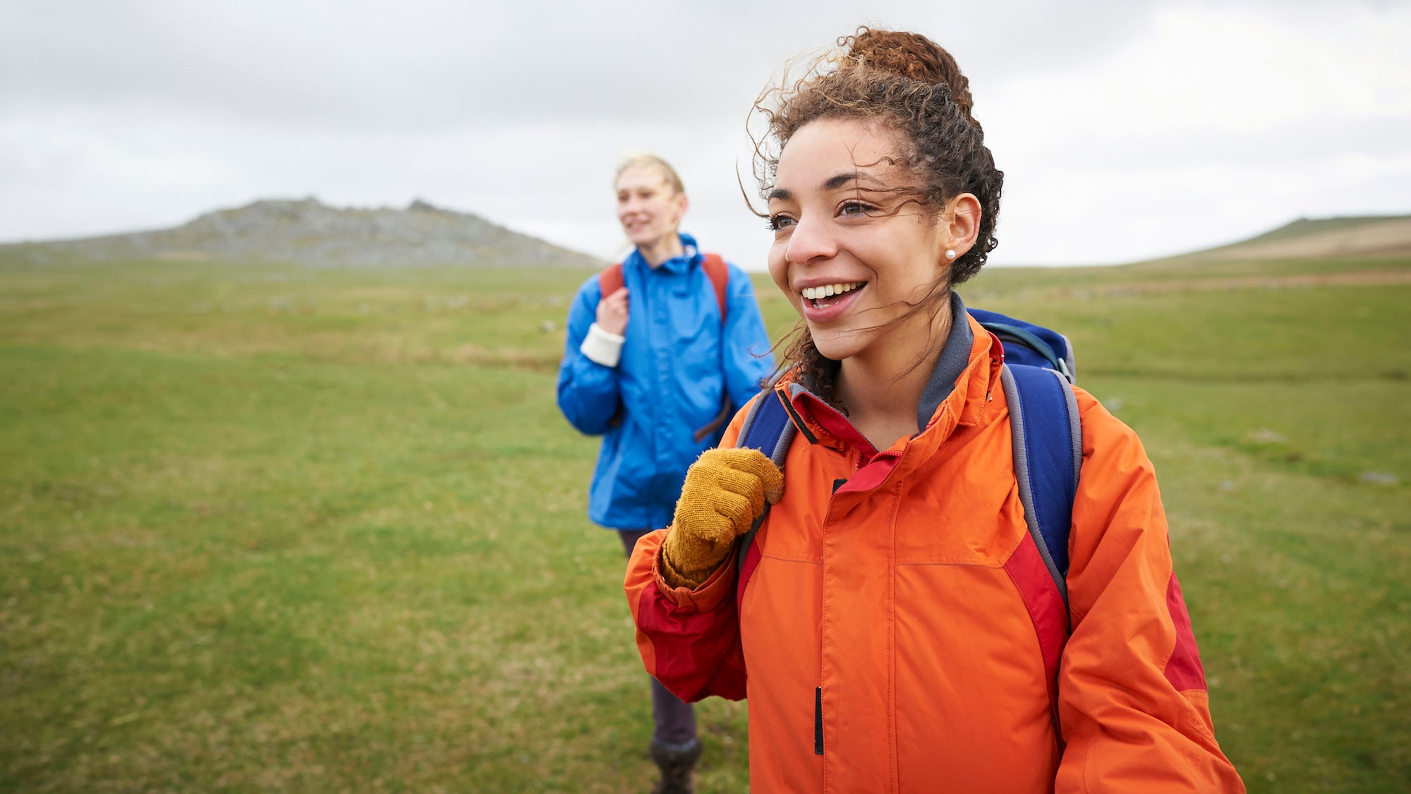 Female hikers walking in countryside