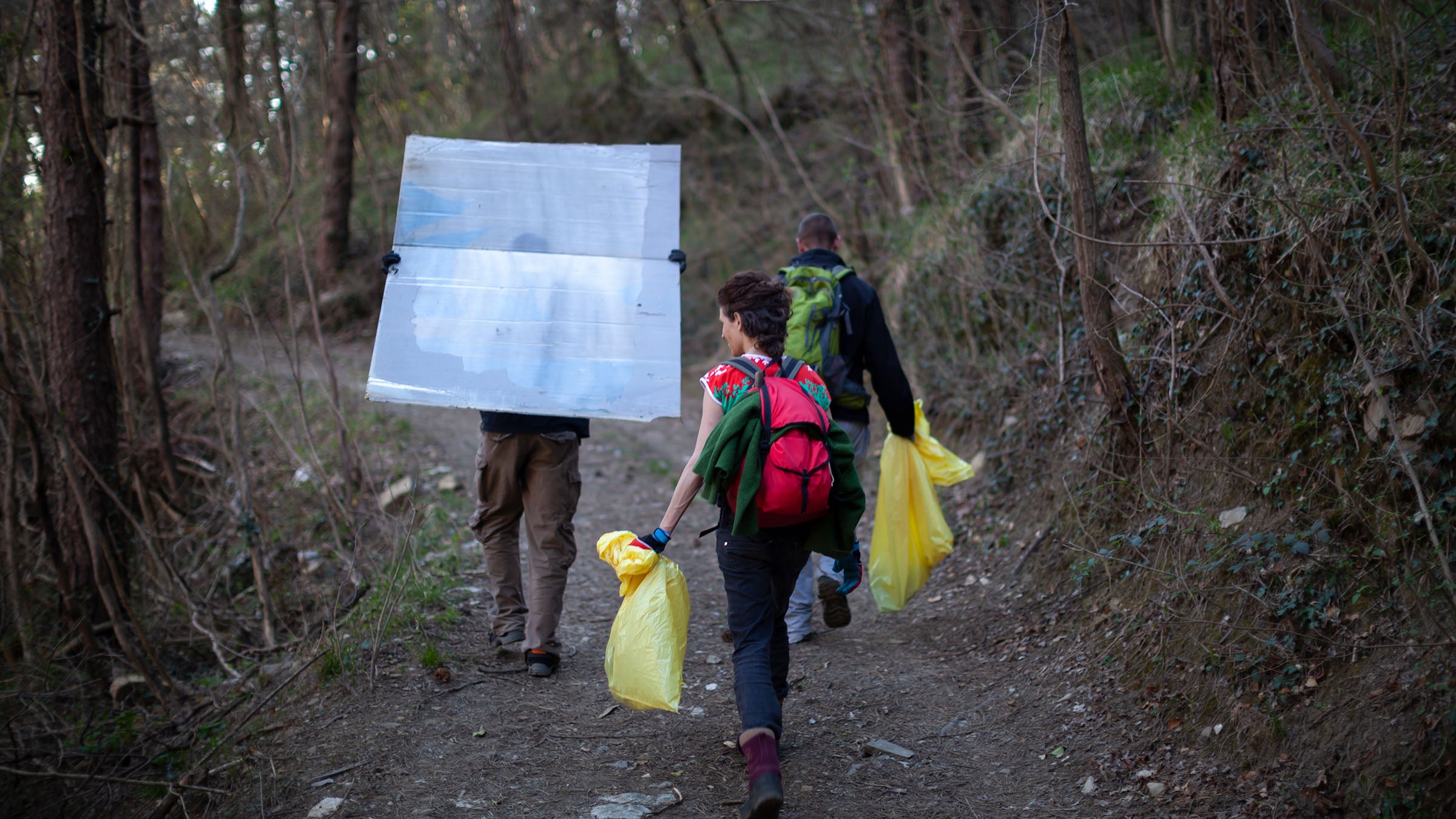Hikers picking up garbage