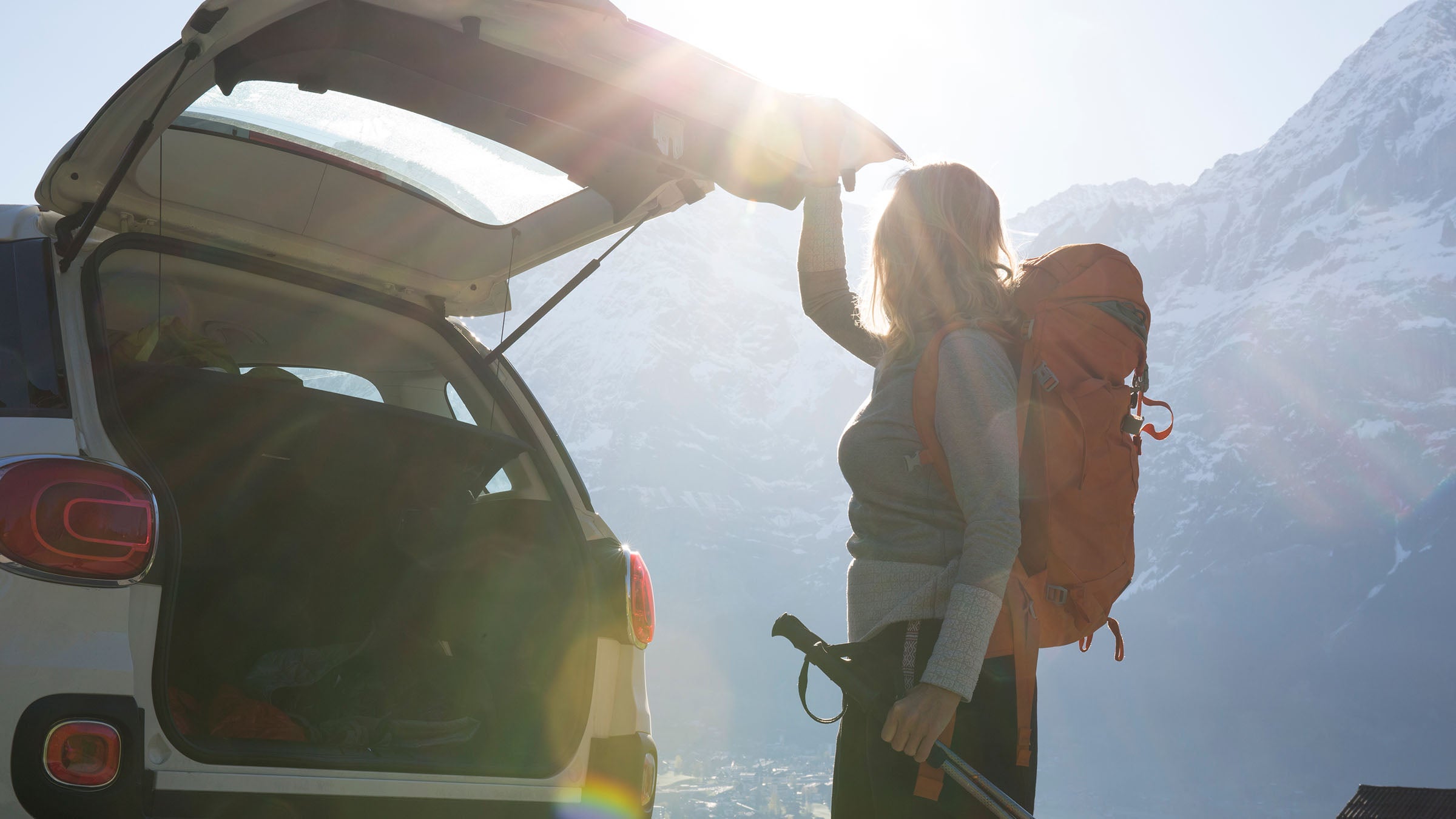 Hiker getting into car