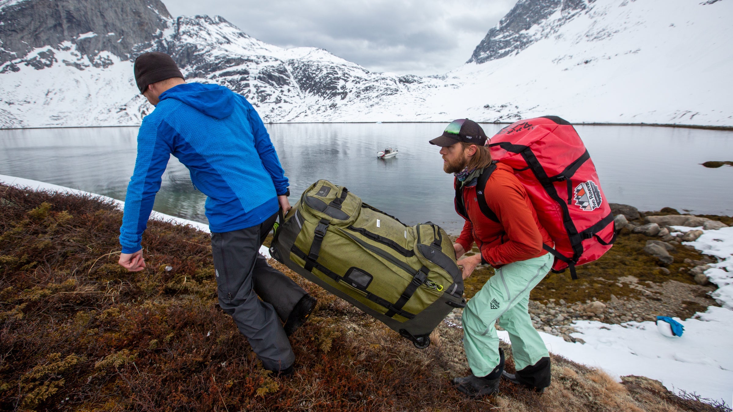 Skiers hauling gear best winter travel gear