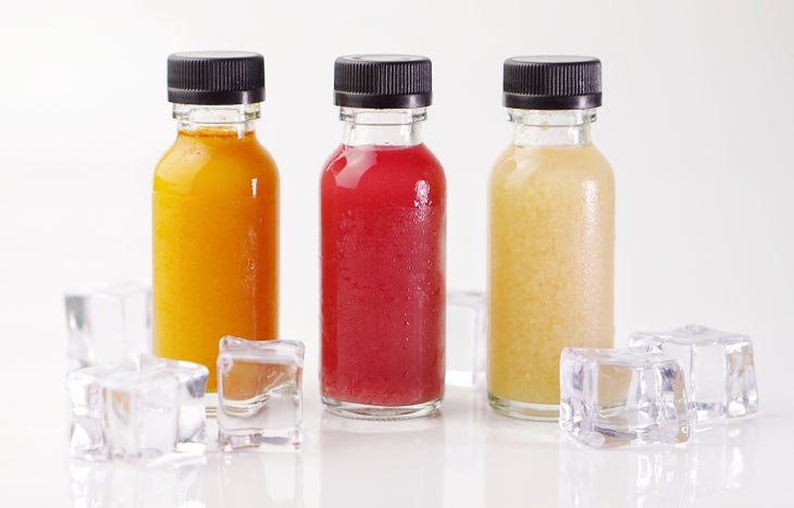 Juice in small clear glass bottles