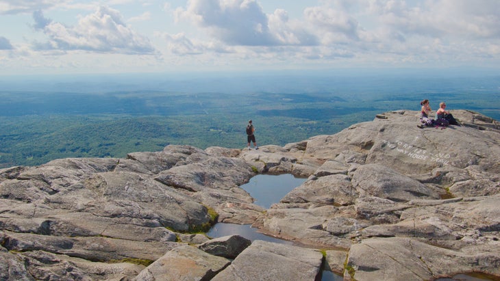 hikers on top of rocky mountain