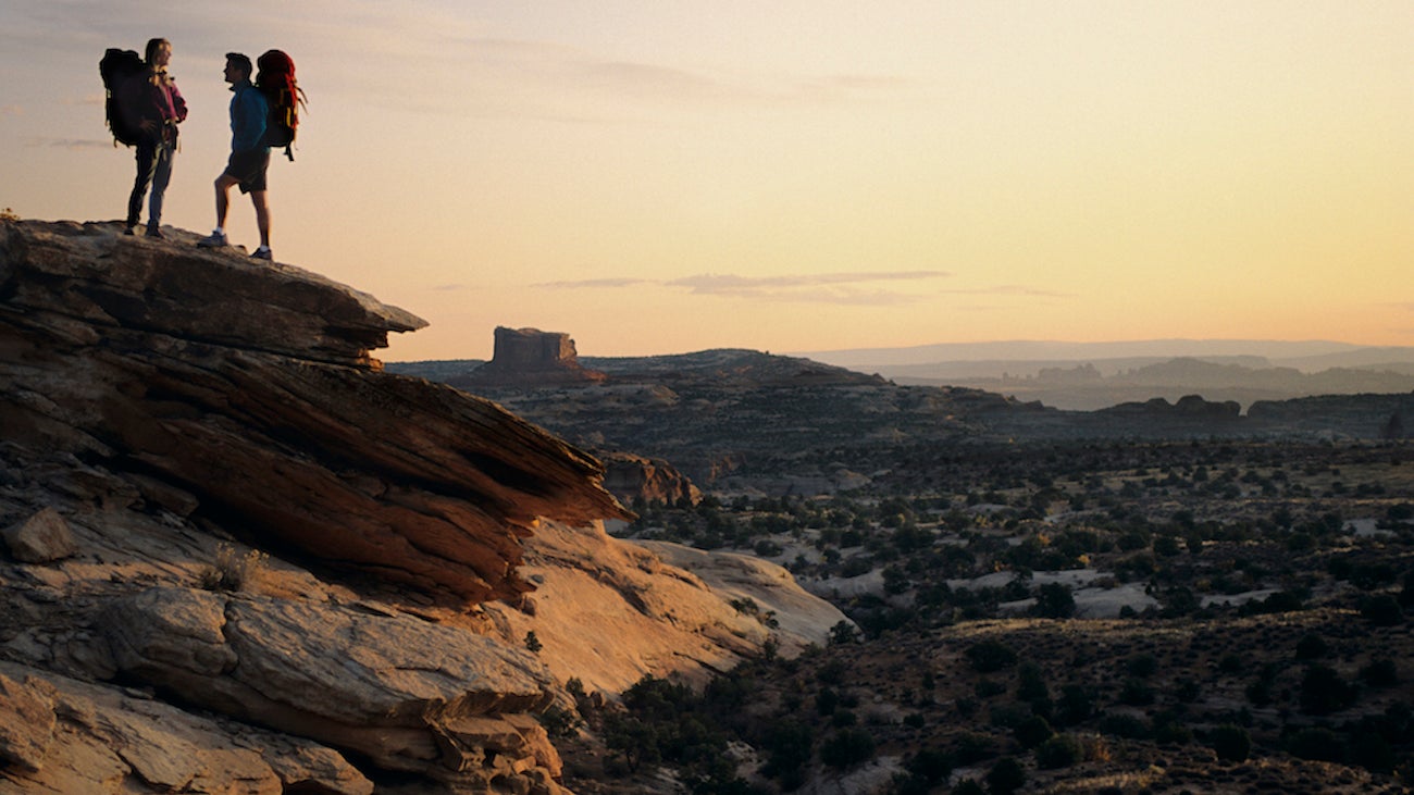 1990s Two Anonymous Silhouetted Hikers On The Way To Canyonlands Near Moab Utah