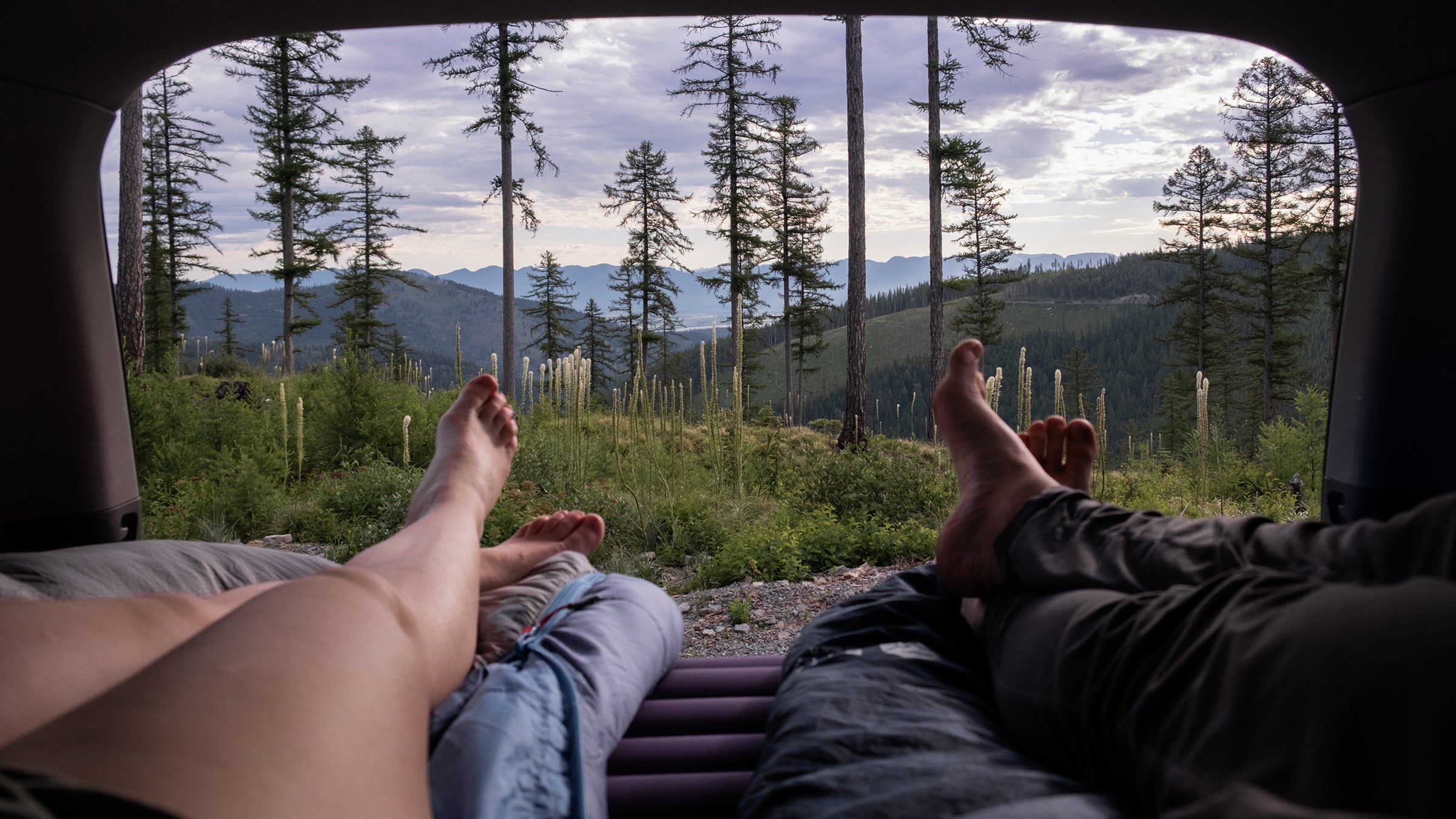 view from inside a car laying on a camping pad