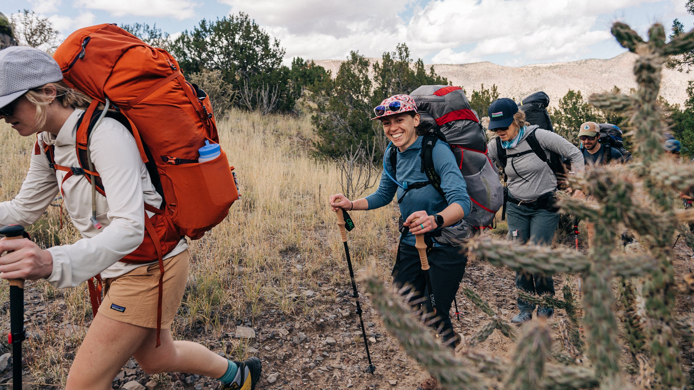 hikers testing backpacking gear on a trail