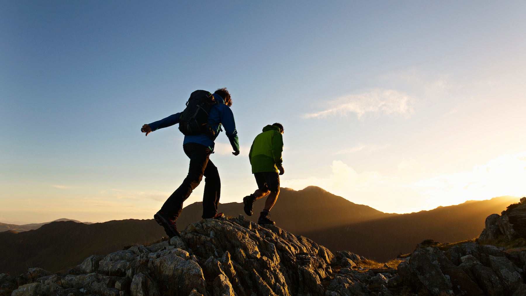 Men hiking on rocky mountainside