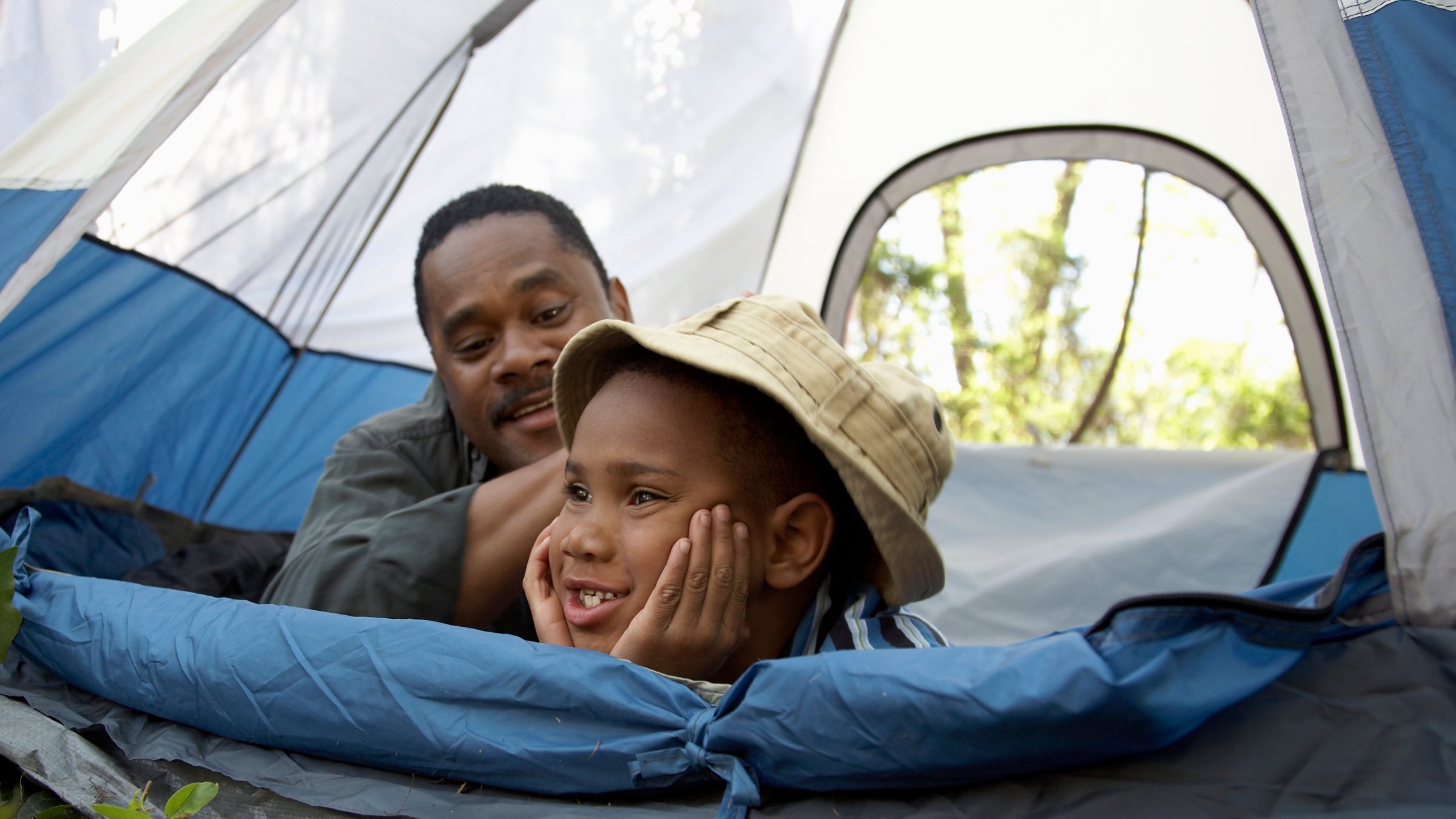 kid and dad in tent