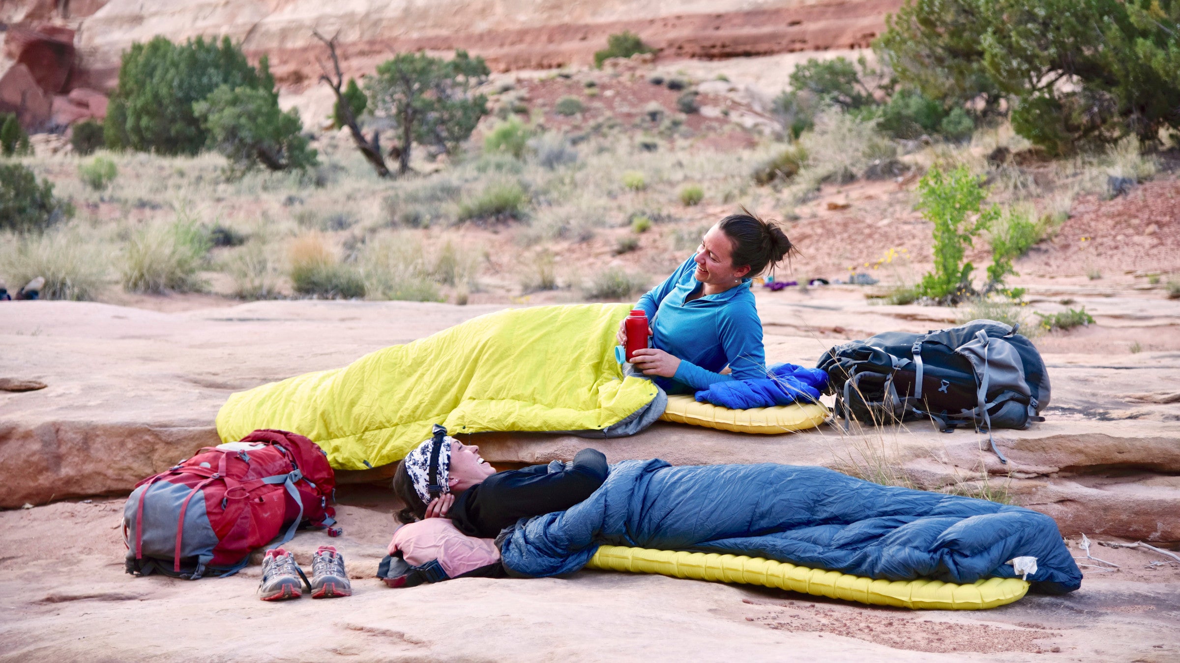 campers lying on rock