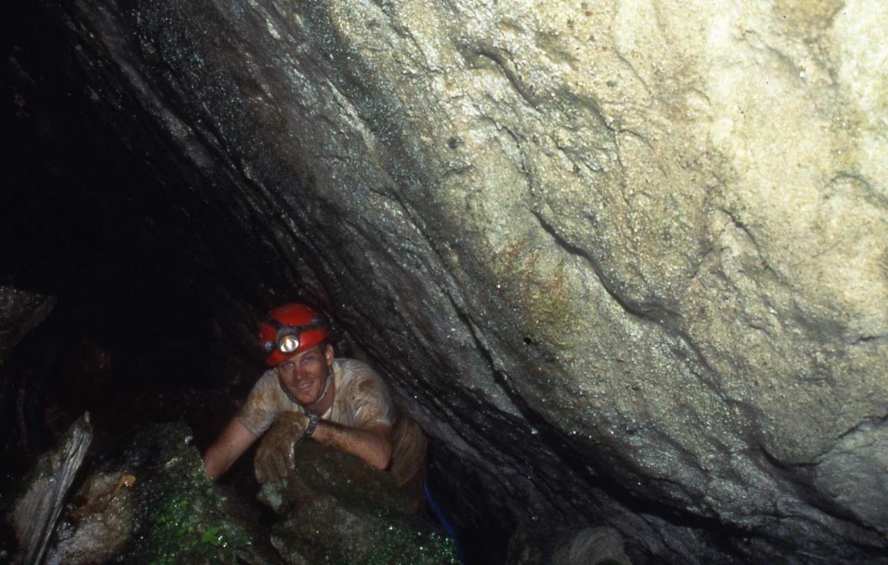 Geologist John Lane exploring a cave.