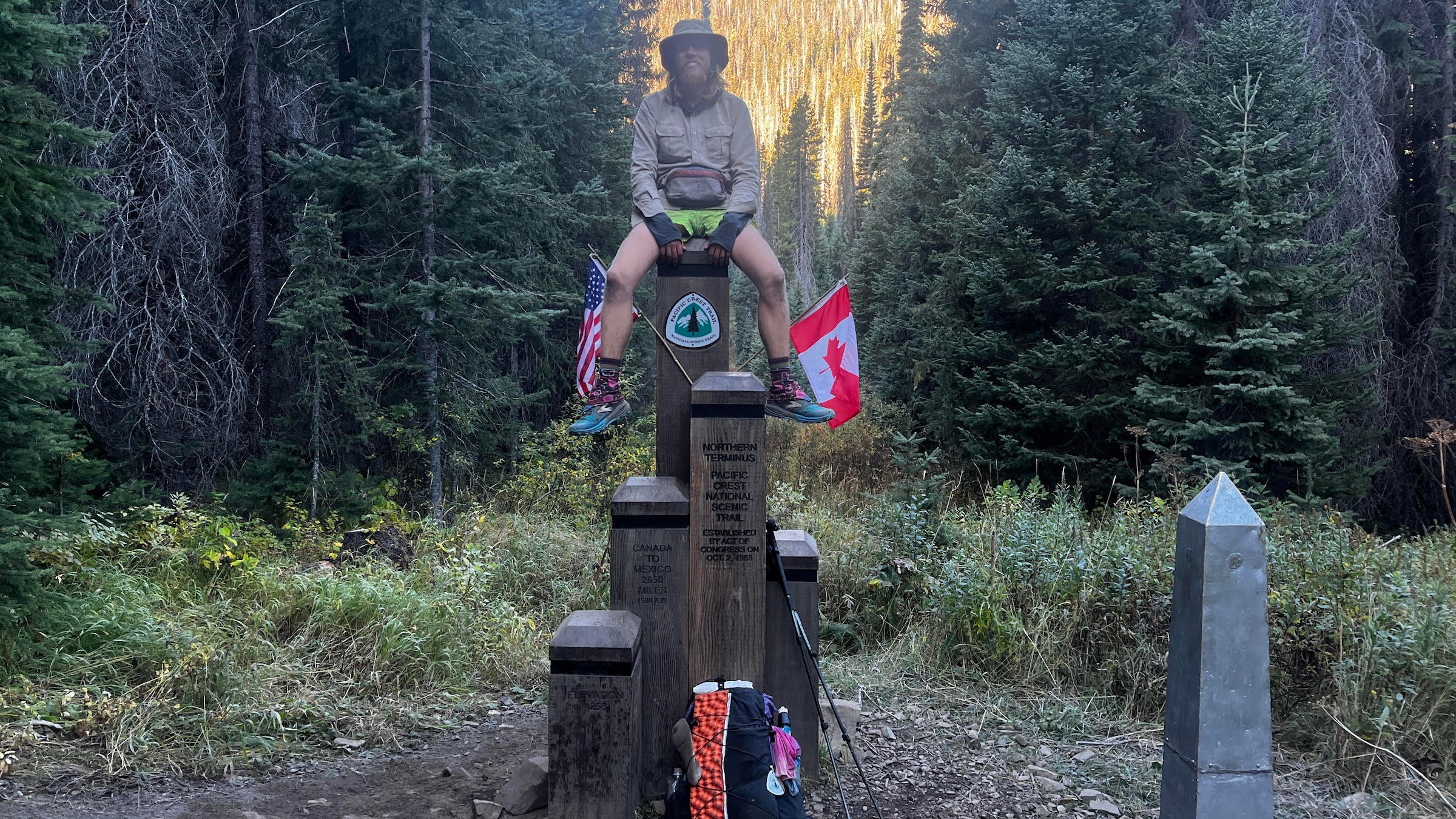 a bearded hiker at the northern PCT terminus