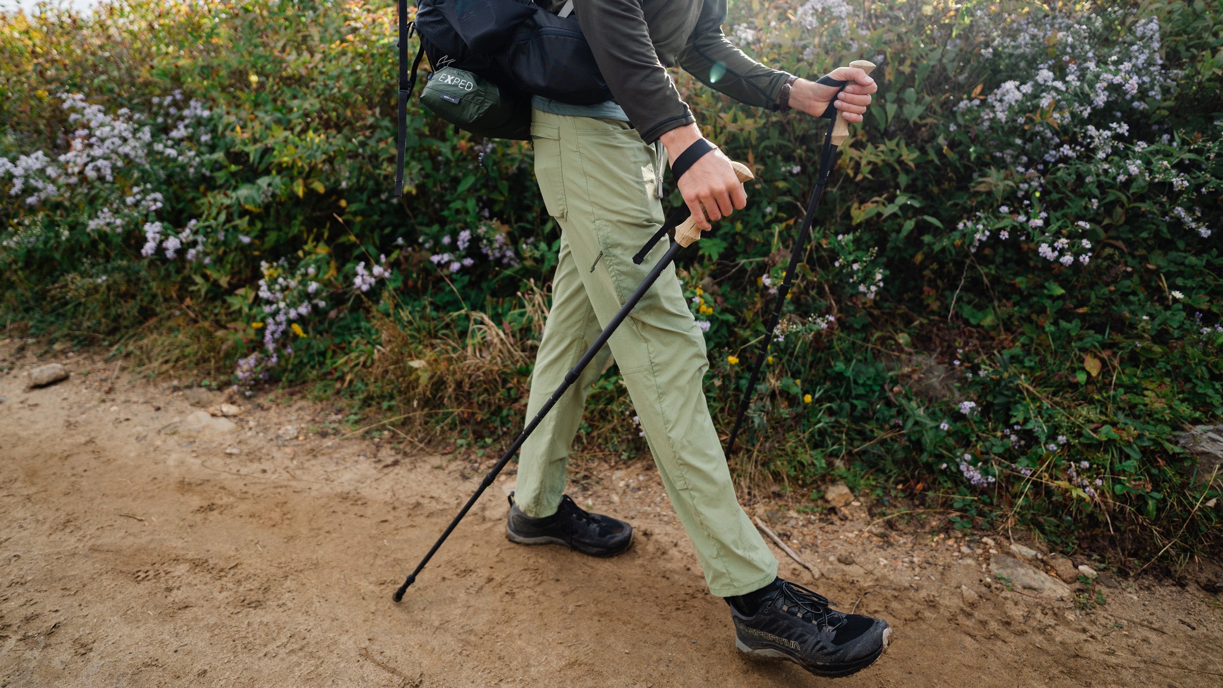 A category manager testing hiking pants