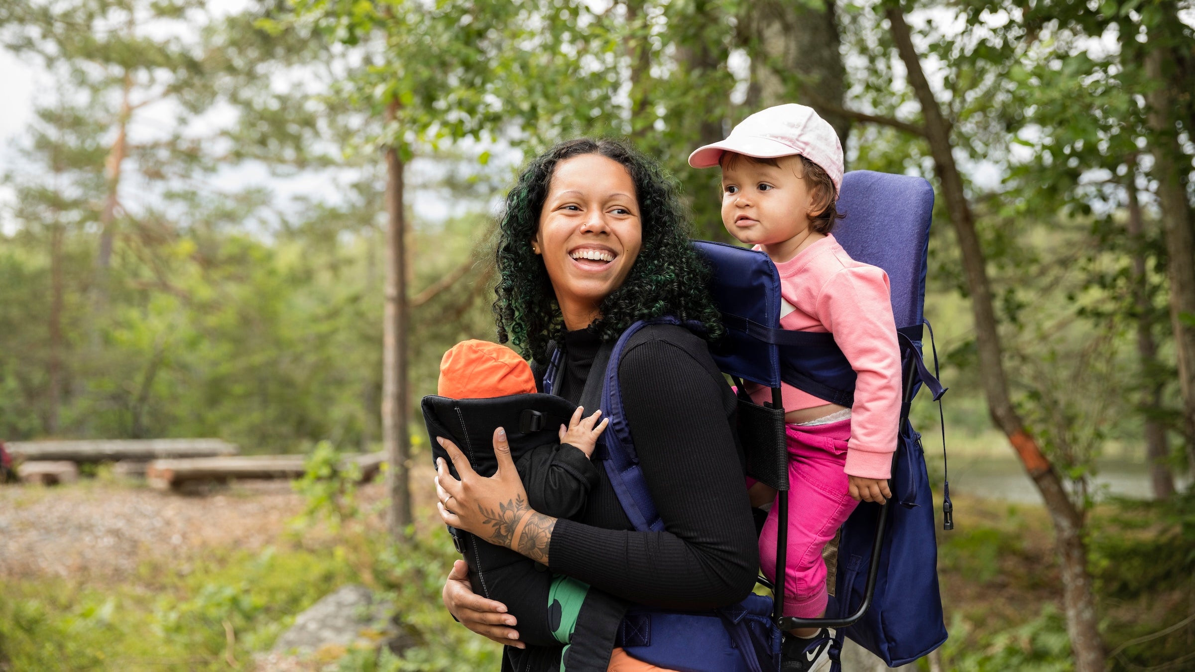 mother with children hiking in forest