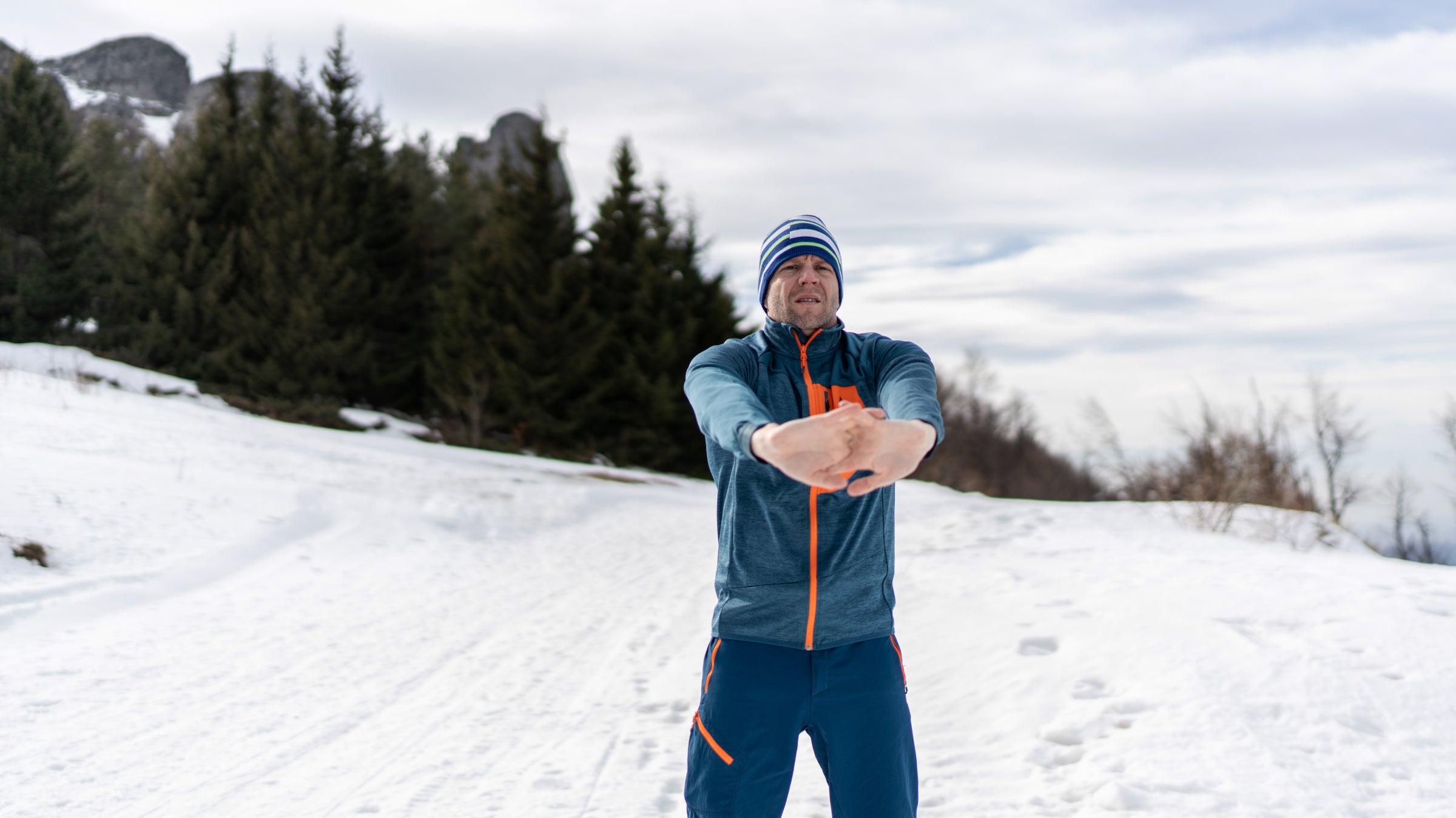 Hiker stretching arms