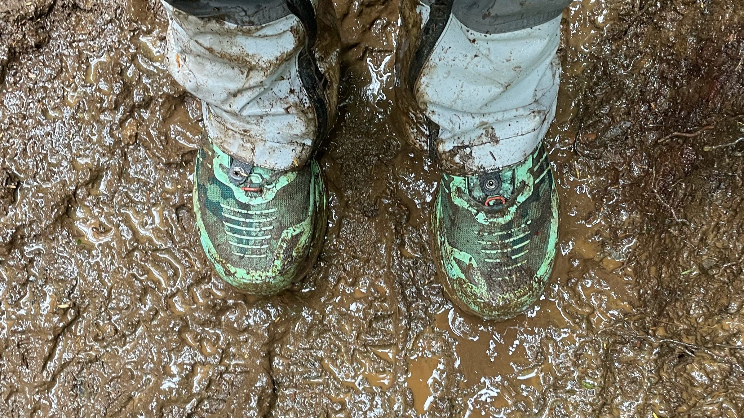 waterproof hiking boots covered in mud