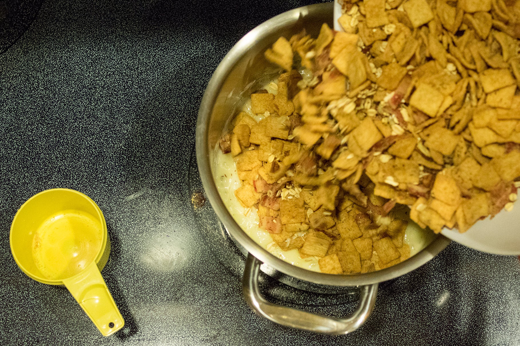 Bacon Krispy Bars: Step 4 Add cereal and bacon mixture. Stir well, using a rubber scraper, until well incorporated.