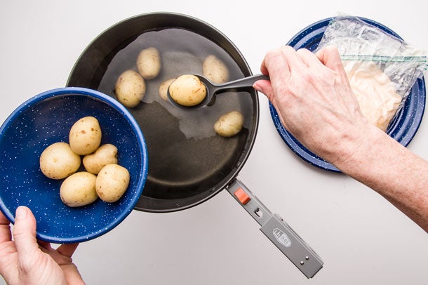 Fondue: Step 8 Scoop potatoes out of hot water