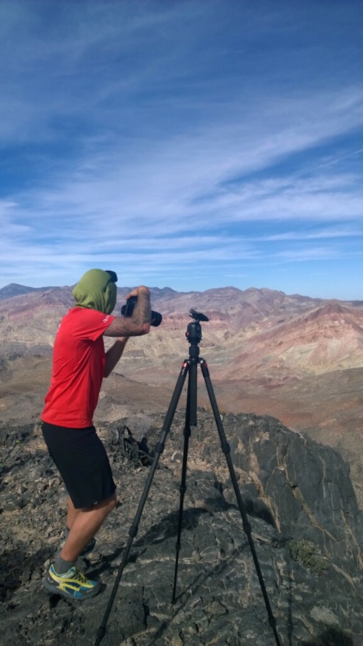 Photography on the rocks. Photographer Andrew Bydlon lines up his shot.